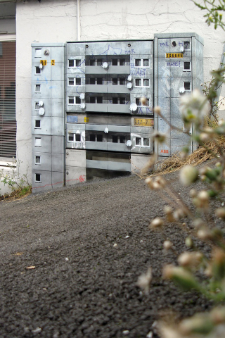 Illustration for article titled Artist Converts Everyday Objects Into Super-Realistic Miniature Apartment Buildings